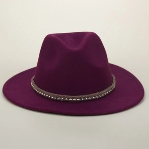 Detail of deep purple fedora hat with woven brown band and silver metallic rivets décor