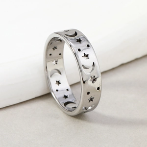 Polished stainless steel band with cutout star and moon patterns for men and women