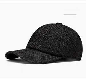 Close-up of the breathable straw weave texture on a black vintage baseball cap