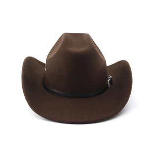 Detailed macro view of dark brown cowboy hat with leather band and silver buckle