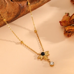 Golden bee insect pendant necklace with black opal and sparkling crystal stone details