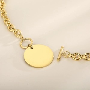 Polished gold titanium steel O-chain necklace with a blank round pendant and T-bar clasp