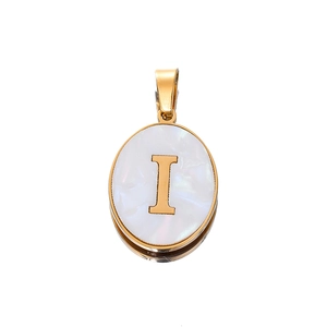 Macro detail of oval shell letter I pendant in gold-plated stainless steel