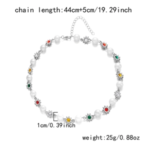 Detail view of pearl and colorful rhinestone flower necklace with size and weight info
