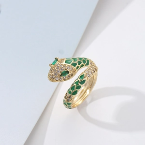 Detail of brass snake ring with green enamel scales and pavé cubic zirconia accents