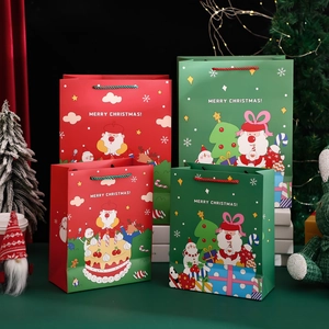 Christmas hollow gift bags in red and green with festive patterns and Merry Christmas text