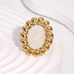 Vintage 18k gold plated stainless steel ring featuring a white oval relief cameo sun design