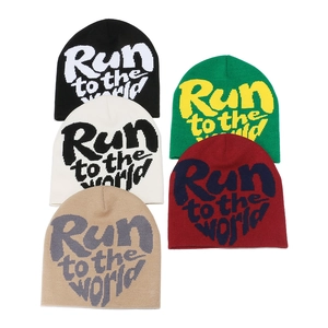 Knit beanies with Run to the world slogan jacquard in five different trendy colors