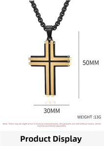 Detail of two-tone black and gold cross pendant with dimensions 50mm by 30mm