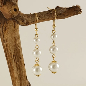 French style 18k gold plated drop earrings featuring three graduated pearls and hooks