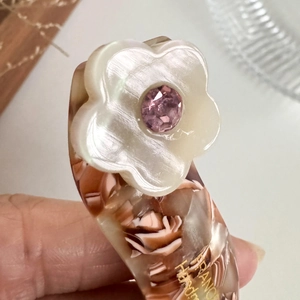 Brown marble acetate hair clip with white shell flower and pink crystal accents