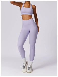 Detail of lavender yoga set showing high-waisted leggings and sports bra texture