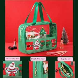 Detail of Christmas green chenille glitter happy letters and smooth metal zipper bag