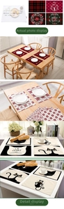Close-up of red plaid cotton linen placemat with festive Christmas reindeer and wreath patterns