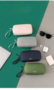 Flat lay of large capacity digital organizer bags in pink, grey, green and blue colors