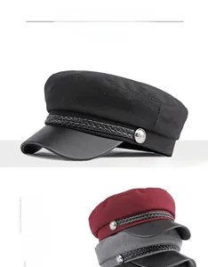 Detail of wool baker boy cap with leather visor and braided cord in various colors