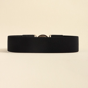 Close-up of black elastic waist belt with a round metal buckle on a plain background