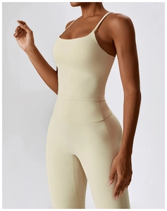 Detail of breathable beige yoga camisole showing fine stitching and matte fabric texture