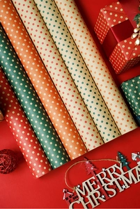 Christmas bouquet wrapping paper rolls with classic red and green polka dot festive designs