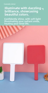 Detail of red and white handheld vanity mirrors on a clean decorative background