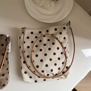 Detailed texture of dot pattern corduroy shoulder bag with elegant leather strap