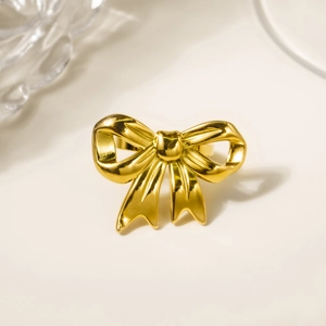 Polished 18K gold plated stainless steel bow ring featuring a minimalist design for women