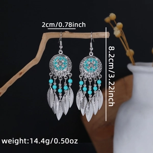 Detail showing bohemian tassel earrings with turquoise beads and precise dimensions