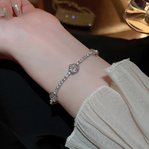 Close-up of elegant zircon rose flower bracelet featuring silver-toned floral frames