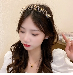 Close-up of Happy Birthday headband with sparkling white rhinestones on model