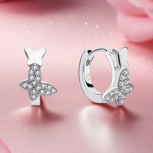 Macro shot of 925 sterling silver butterfly hoop earrings with sparkling cubic zirconia
