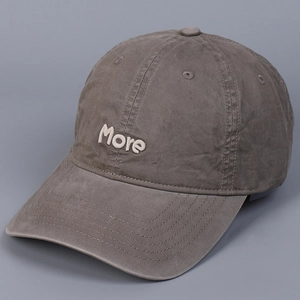 Detail of premium charcoal grey washed cotton baseball cap with white more embroidery