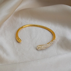 Luxurious 18K gold plated stainless steel open bangle with sparkling pavé set diamonds