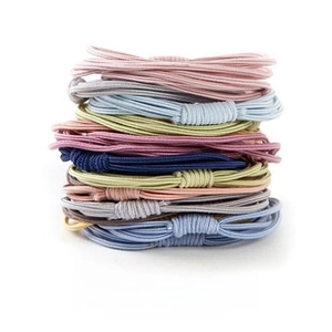 Detailed macro view of colorful high elasticity rubber bands in various soft pastel tones
