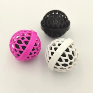 Reusable sticky cleaning ball for handbags and purses in pink black and white colors