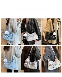 Detail view of large tote bags with metallic butterfly accents and cute plush pendants