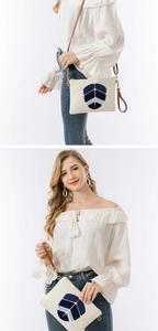 Canvas-Clutch mit blauer Blattstickerei und verstellbarem braunem Leder-Schultergurt