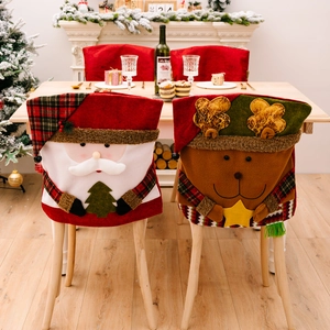 Christmas Santa and Reindeer chair covers displayed in a festive home dining room setting