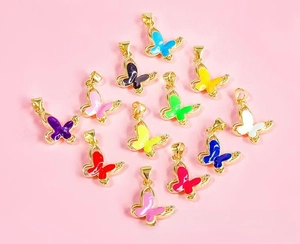 Detailed flat lay of butterfly charms in 12 colors for DIY jewelry making