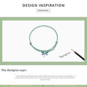 Detailed sketch showing a silver dragonfly charm with green woven cord and zircon stones