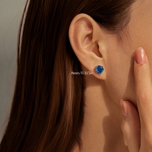 S925 sterling silver royal blue rose cut earrings 8mm size shown on a model's ear