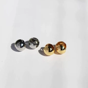 Polished gold and silver ball drop earrings in a minimalist round metallic sphere style