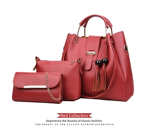 Three-piece set of wine red litchi grain leather handbags with tassels and metal chain