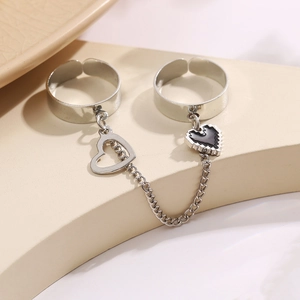 Punk style silver double finger ring with tassel chain and black pixel heart charm