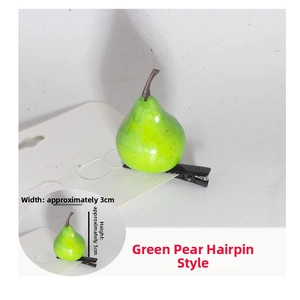 Detailed view of a green pear hair clip with black duckbill clip, size 5cm by 3cm