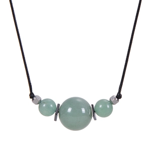 Detail of 16MM natural malachite bead pendant with silver spacers on black cord necklace