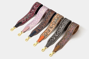 Detail of colorful Paisley patterned wide replacement straps with gold lobster clasps
