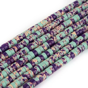 Macro shot of cylindrical emperor stone beads in purple and mint green for jewelry DIY