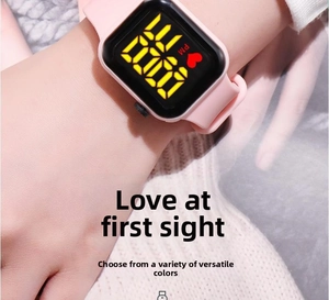 Pink LED digital touch screen watch with silicone strap worn on wrist for students