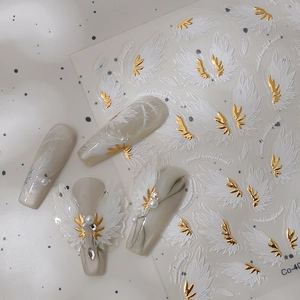 3D Angel Wings nail stickers with gold stamping and white feathers for elegant manicures