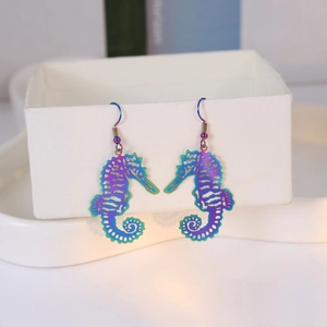 Rainbow laser seahorse dangle earrings in iridescent hollow laser-cut stainless steel
